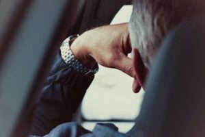 Professional sitting in car after work struggling to wind down from burnout and anxiety